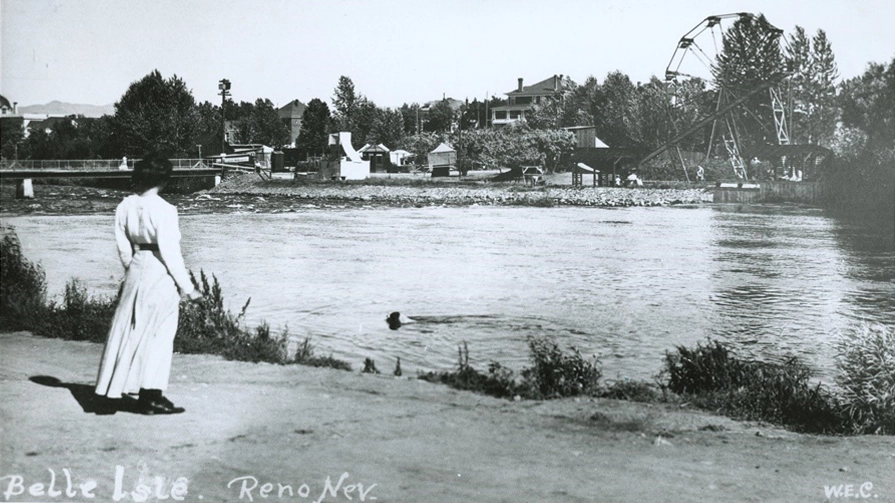 Woman standing on the shore of a lake