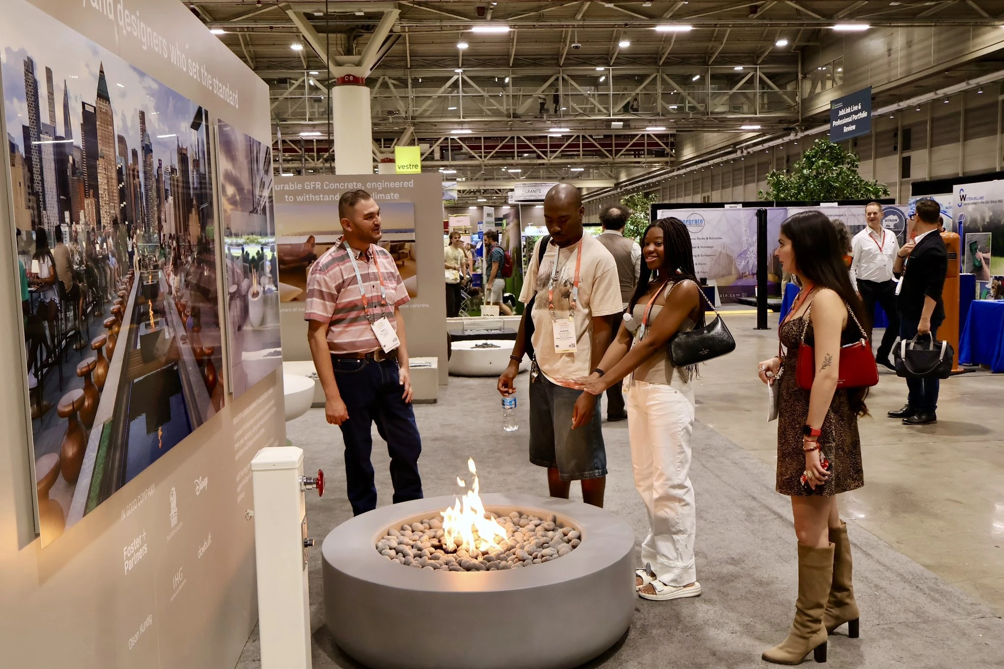 EXPO attendees standing around fire pit