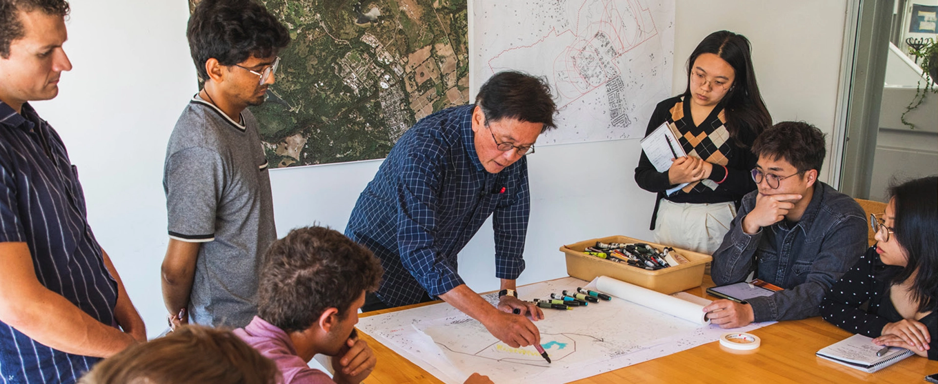 A design leader mentoring a group of emerging professionals