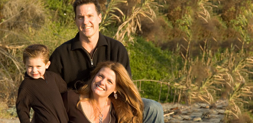 Family wearing black clothing outside